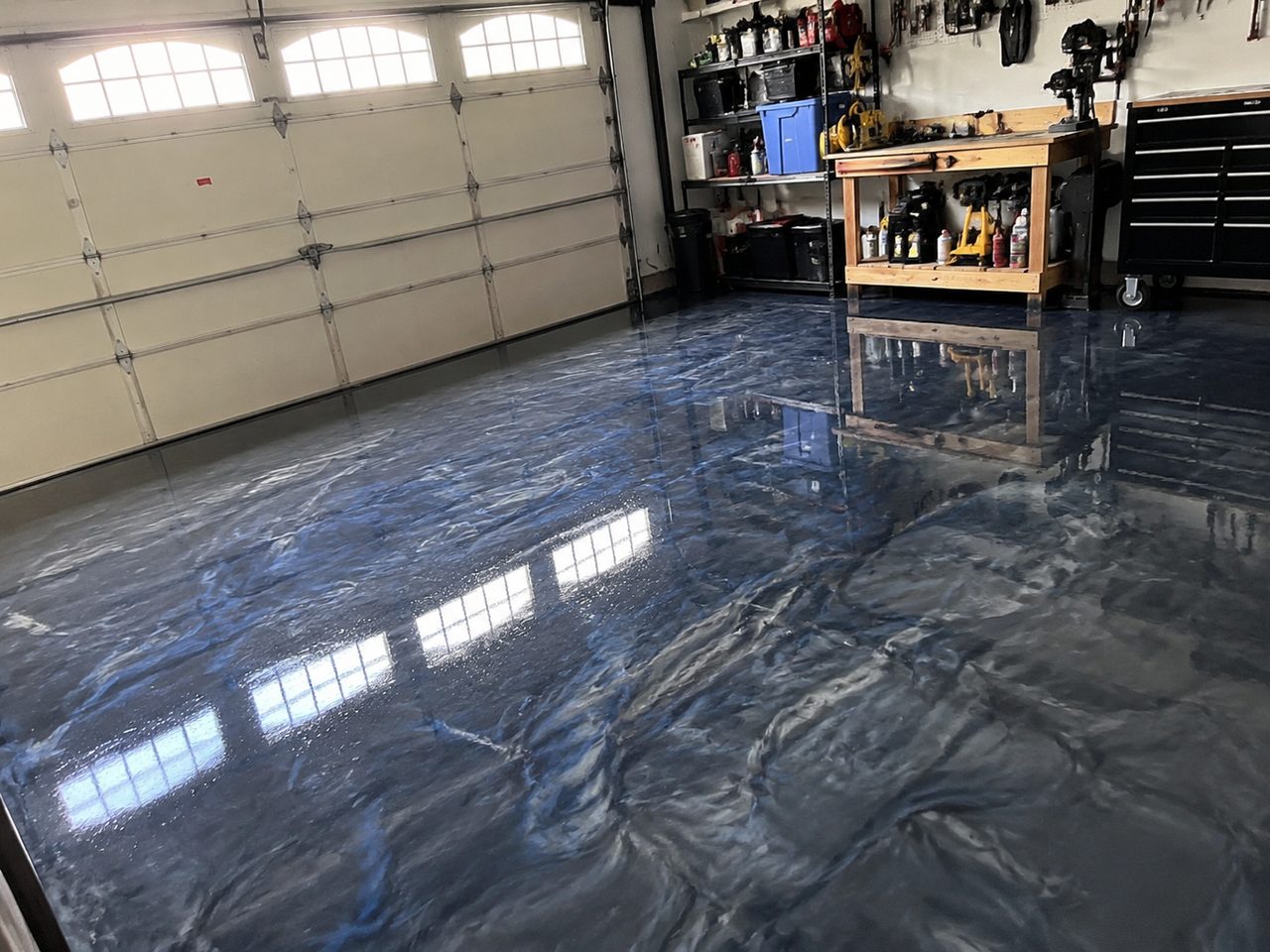 Metallic blue epoxy garage floor coating after installation in Daytona Beach
