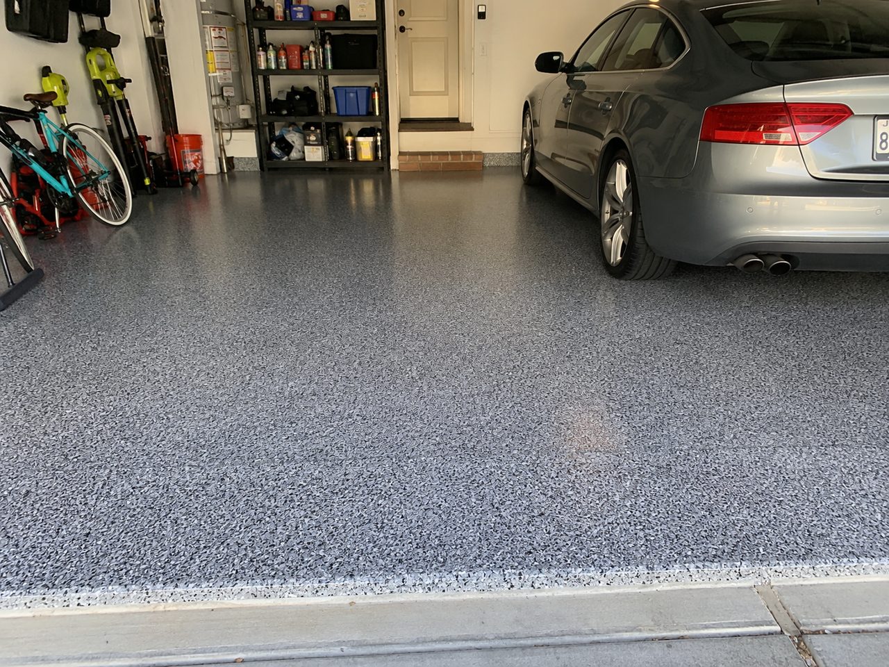 Gray flake epoxy garage floor coating after installation in Daytona Beach