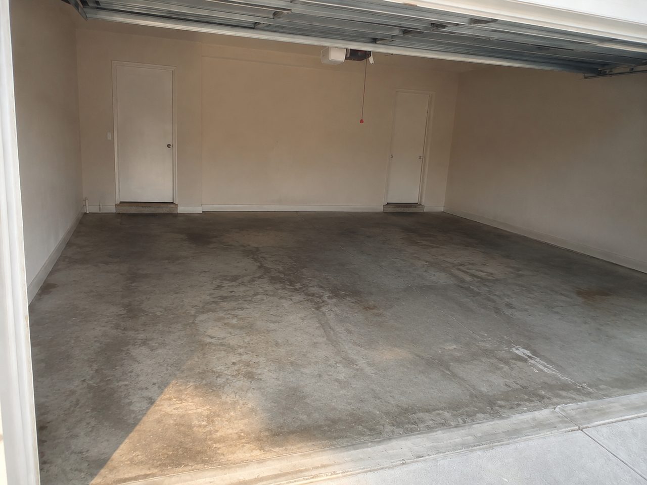 Dusty bare concrete garage floor before coating in Daytona Beach